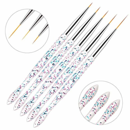 Nail art dotting tools with decorated nails.