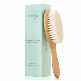 Wooden baby hair brush with soft bristles and packaging.