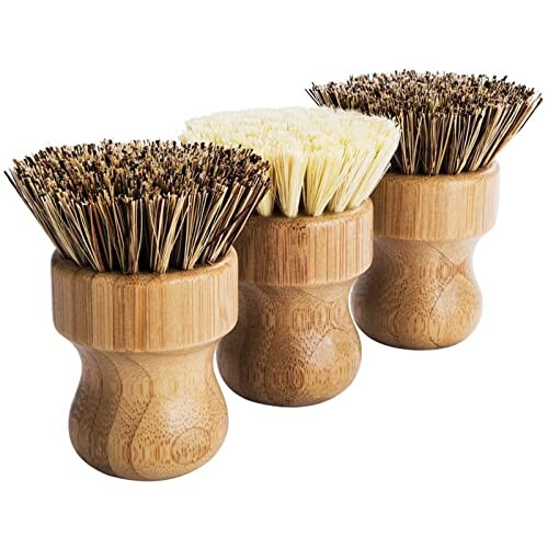 Three bamboo dish brushes with different bristle types.