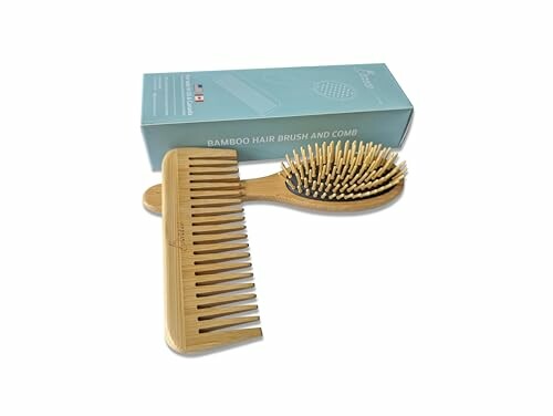 Bamboo hair brush and comb set with packaging.