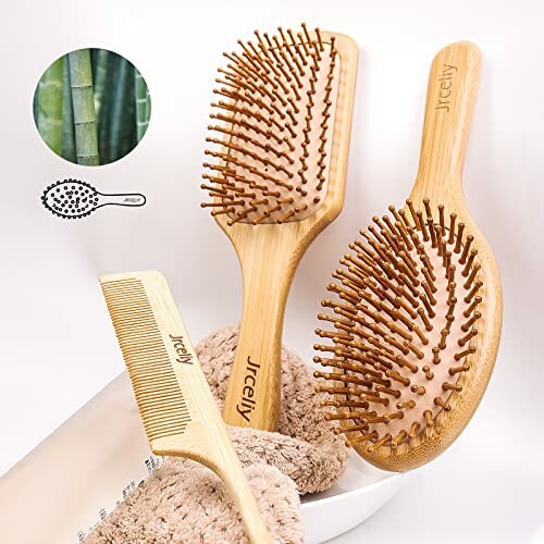 Bamboo hair brush and comb set with towel.