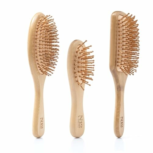 Three bamboo hair brushes with wooden bristles