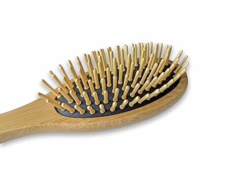 Bamboo hairbrush with wooden bristles.