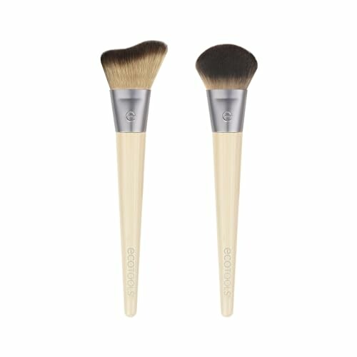 Two eco-friendly makeup brushes with bamboo handles.