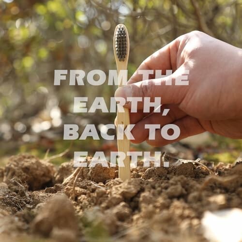 Hand planting bamboo toothbrush in soil with text overlay.