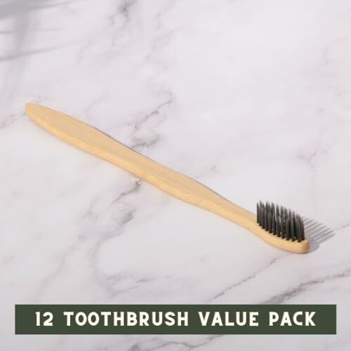 Bamboo toothbrush on a marble surface with text '12 Toothbrush Value Pack'.