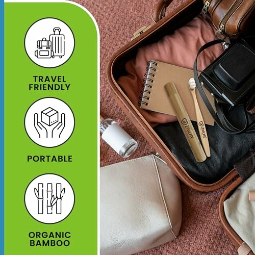 Open suitcase with bamboo toothbrush and travel items.