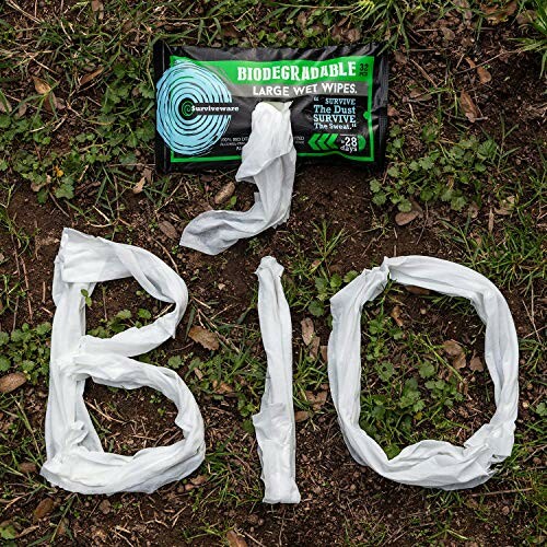 Biodegradable wet wipes with 'BIO' spelled using wipes on grass.