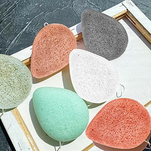 Various colorful konjac sponges on a tray