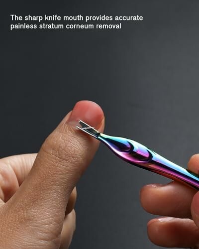 Close-up of a cuticle removal tool being used on a thumb.