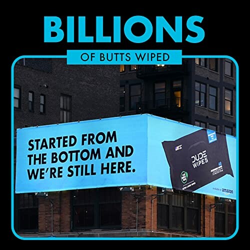 Dude Wipes billboard with slogan 'Started from the bottom and we're still here.'