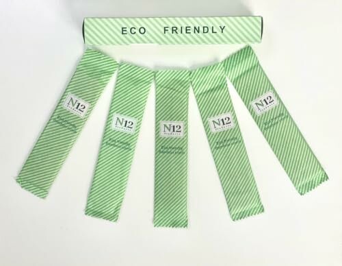 Eco-friendly green striped biodegradable straws.