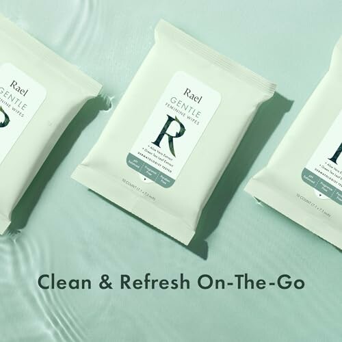 Three packs of Rael Gentle Feminine Wipes on a light green surface.