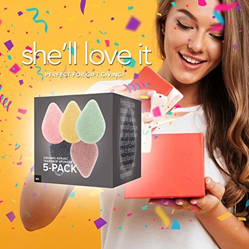 Woman holding gift with box of colorful konjac sponges