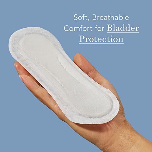 Hand holding a soft, breathable bladder protection pad.