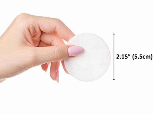 Hand holding a round cotton pad with size measurement.