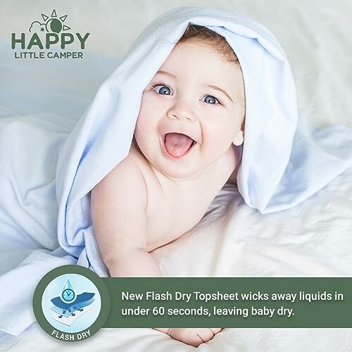 Smiling baby under a blue towel with text about Flash Dry Topsheet.