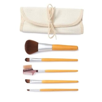 Set of makeup brushes with a canvas roll-up pouch.