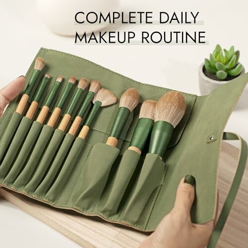 Green makeup brush set with 12 brushes in a roll-up pouch.