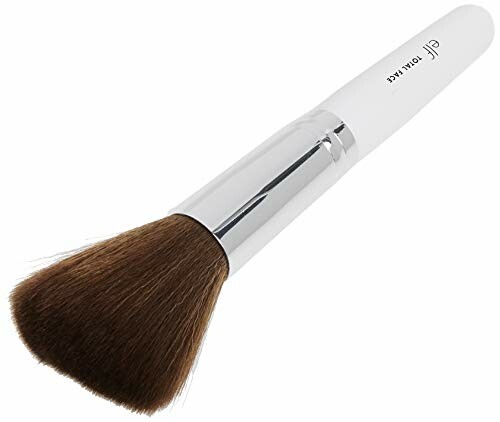 Makeup brush with white handle and brown bristles