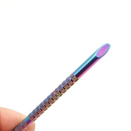 Colorful metal cuticle pusher tool.