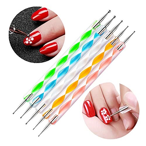 Colorful nail art dotting tools with designs being applied on red nails.