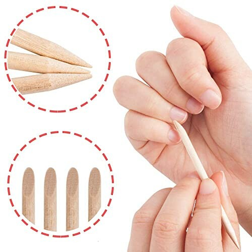 Hands using wooden cuticle sticks for nail care.