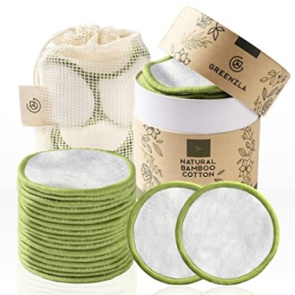 Set of reusable bamboo cotton pads with storage container and mesh bag.