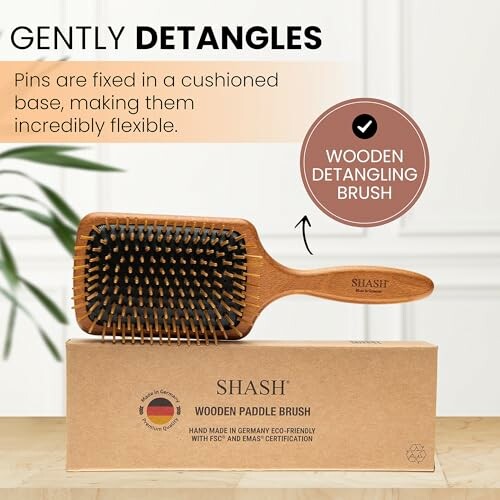 Shash wooden paddle brush with cushioned base for gentle detangling.