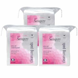 Three packs of Swisspers ultra soft cleansing pads.