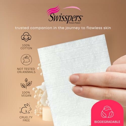 Hand holding Swisspers biodegradable cotton pad with eco-friendly features