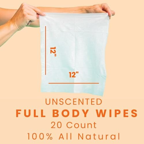 Hands holding a 12x12 inch unscented full body wipe, 20 count, 100% all natural.