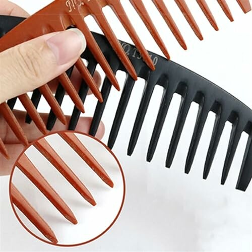 Close-up of two wide-tooth hair combs in brown and black.