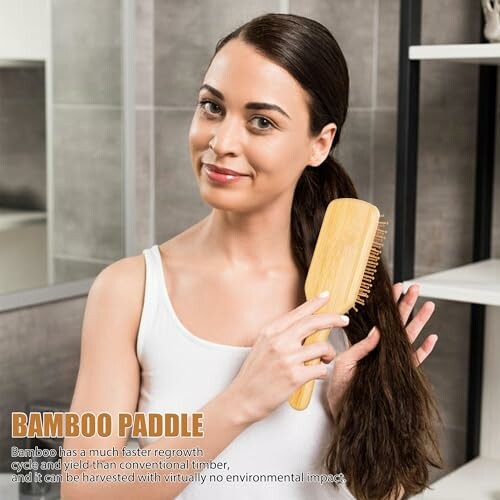 Woman using a bamboo paddle brush on her hair