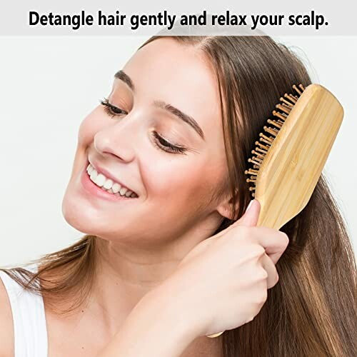 Woman brushing hair with a wooden brush, smiling.