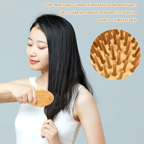 Woman using a massage comb on her hair.