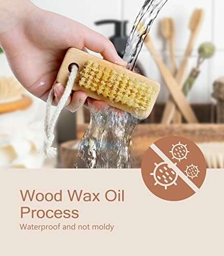 Hand holding a wooden brush under running water, with text 'Wood Wax Oil Process Waterproof and not moldy'.