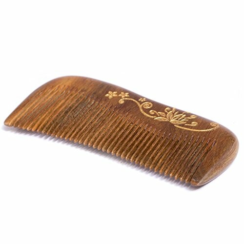 Engraved wooden comb with floral design