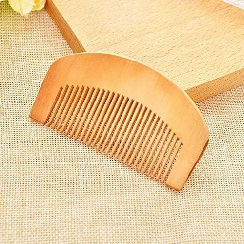 Wooden comb on burlap surface