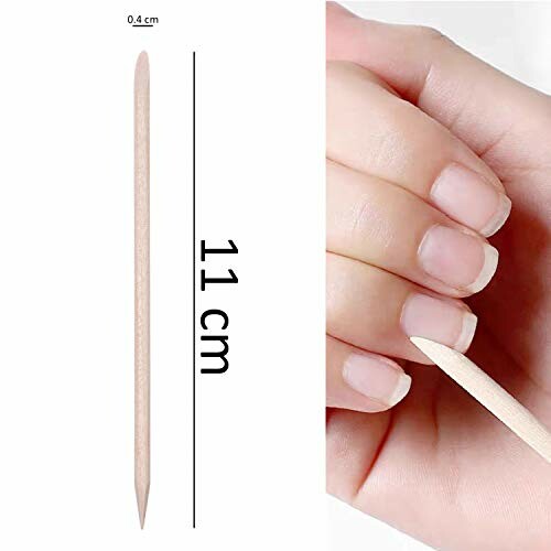 Wooden cuticle pusher next to fingers.