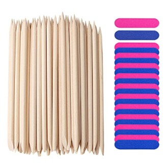 Wooden cuticle sticks and colorful nail buffers.