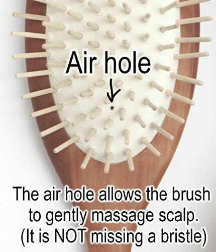 Wooden hair brush with air hole for scalp massage.