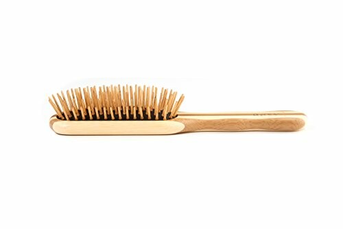 Image of a wooden hair brush with natural bristles, showcasing its durability and sturdiness