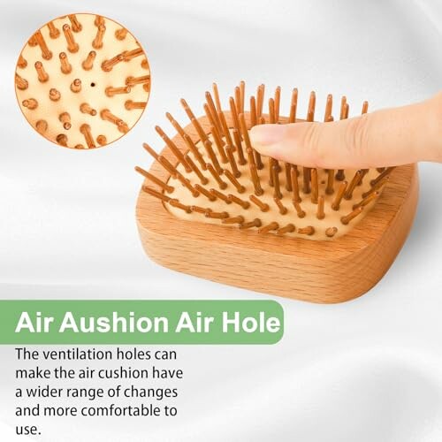 Finger pressing wooden hairbrush with air cushion holes.