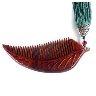 Wooden leaf-shaped comb with green tassel and beads