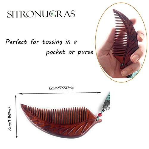 Wooden leaf-shaped comb with dimensions and hand holding.