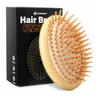 Wooden scalp massager hair brush with packaging.