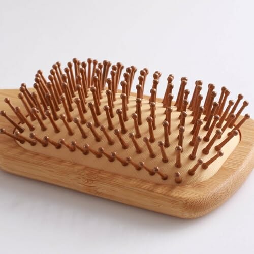 Wooden scalp massager with rounded pegs