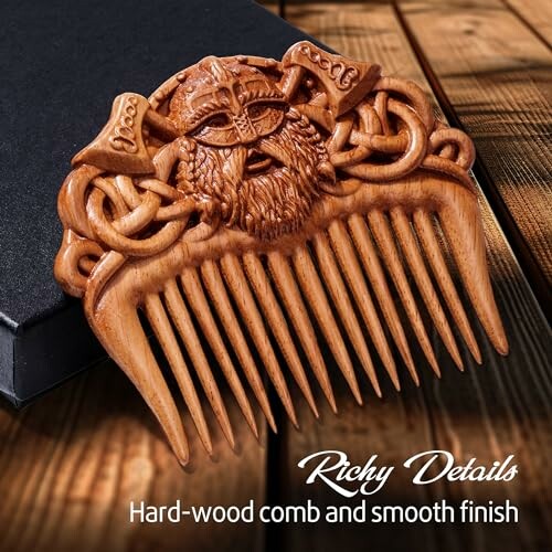 Intricately carved wooden Viking comb on a wooden surface.